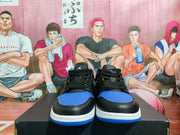 Front view showing the black laces, blue toe panels, and white midsoles