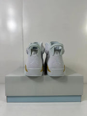 Rear view showing the heel pull tabs and Jordan branding on the white high-top sneakers.