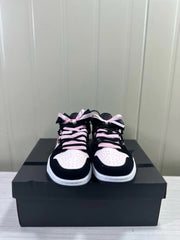 Front view highlighting perforated toe panels and pink-and-black laces