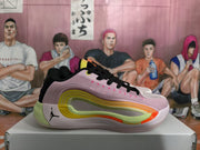 Side view of a Jordan basketball sneaker in pink, black, lime, white and orange, displayed on a shoebox.
