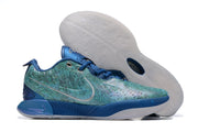 Blue and teal patterned Nike basketball shoes with a translucent-looking outsole.