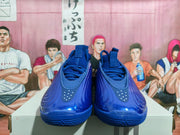 Front view of royal blue Nike basketball shoes with lace-up fastening and perforated toe details.