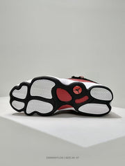 Bottom view showing the white, red, and black segmented outsole pattern.