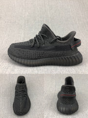 Side and rear views of the black knit-look sneaker with ribbed sole and red heel stitching.