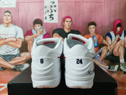 Rear view showing blue heel numbers, white padded collars, and blue heel graphics.