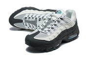 Nike Air Max 95 TT sneakers in a three-quarter view showing the mesh upper and layered panels