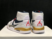 Rear view of the pair showing the white heel panels, red Jordan branding and gold midsole sections.