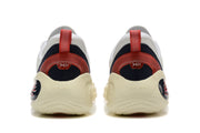 Rear view of white basketball shoes with dark heel panels and red pull tabs
