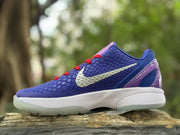 Opposite side view showing the textured purple-blue upper, white Swoosh, white midsole, and translucent outsole.