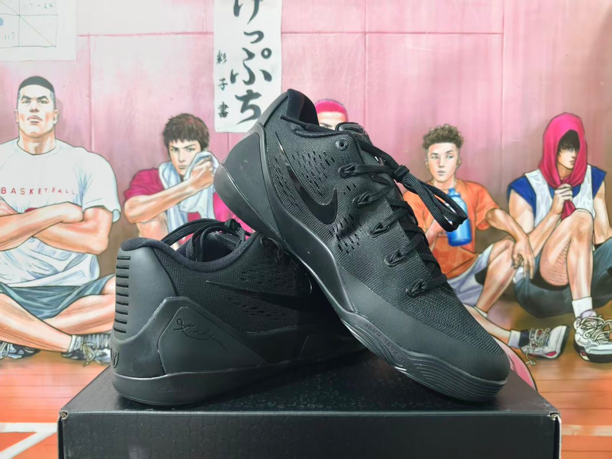 Pair of black Nike basketball sneakers shown at an angled side view on a shoebox.