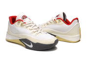 Angled pair view of cream Nike S.T. Flare EP shoes.
