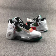 Front three-quarter view of the sneakers with black laces, multicolor mesh, white uppers, and green outsole details.