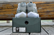 Rear view of the pair displayed above a dark shoe box.