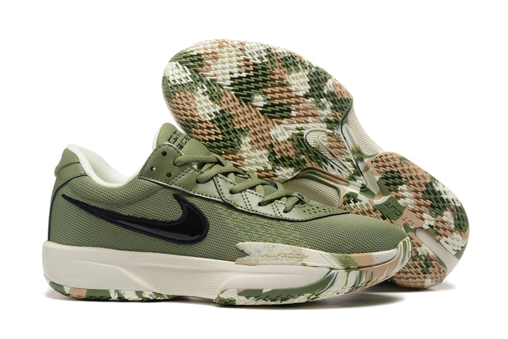 Olive green Nike low-top basketball shoes with camouflage outsole accents.