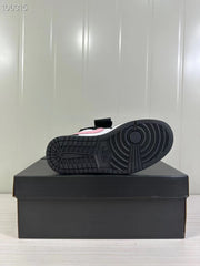 Close view of the black rubber outsole with circular traction patterns.