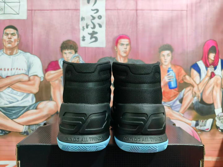 Rear view of black high-top basketball shoes with light-blue outsoles and embossed heel detail.