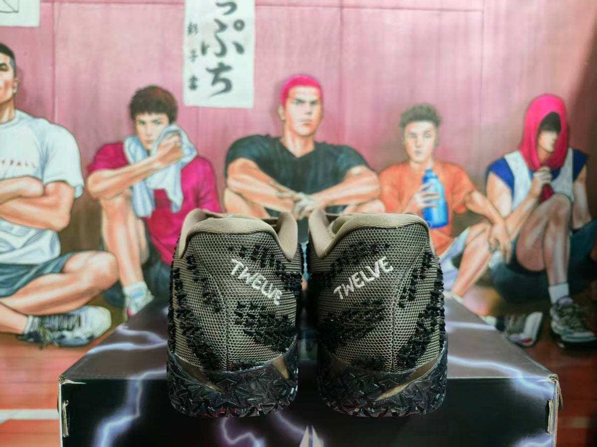 Rear view of brown and black Nike sneakers showing textured heel panels, printed heel details, and a black outsole.
