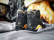 Rear view of the pair showing the Jumpman branding, number 23 details, and gold heel accents.