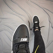 Top view showing the perforated black toe panel, laces, and adjustable forefoot strap.