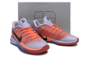 Pair of purple and red Nike Sabrina 3 shoes shown from the front