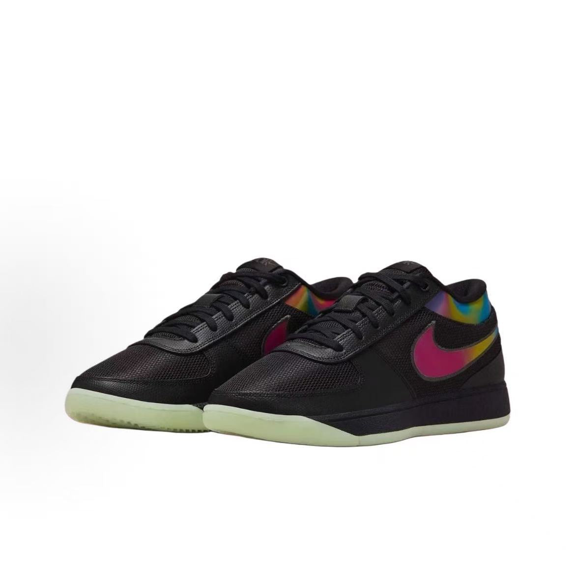 Pair of black low-top sneakers with multicolor Swoosh-style side accents, black laces and pale translucent-looking outsoles.