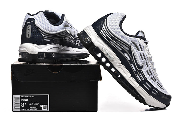 White and dark-accent Nike Air Max 97 OG sneakers displayed with a shoe box; the box label shows sample size EU 42.5.