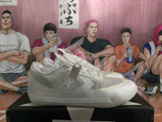 Side view of white low-top sneakers showing the textured upper, tonal laces, star-shaped side detail, and rubber outsole.