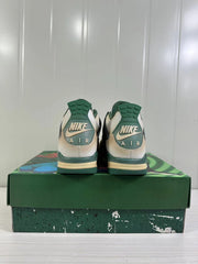 Rear view showing green heel sections, Nike branding and AIR lettering.