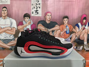 Side profile showing the black upper, layered red side detailing, white midsole section, and translucent-looking outsole.