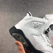 Close-up of the lateral side showing perforated panels, textured upper, and visible heel cushioning window.