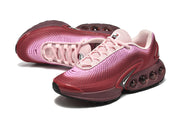 Side and top views highlighting the pink gradient upper and rounded side cushioning.