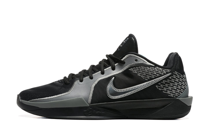 Side view of black and grey Nike Sabrina 2 basketball shoes with patterned heel and Swoosh detail.