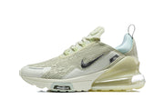 Side profile of a pale green Nike Air Max 270 Premium sneaker.