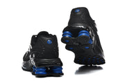 Rear and outsole views of black Nike Shox R4 sneakers with blue cushioning columns.