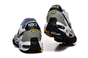 Rear view of the Nike Air Max TW sneakers showing black heel tabs and lugged outsoles.