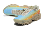 Pair of multicolor Nike Air Max Plus sneakers shown from above and the side