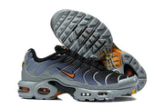 Nike Air Max Plus sneakers showing the side profile and patterned outsole