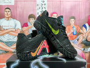 Two black basketball sneakers displayed at an angle, showing contrasting side accents and patterned outsoles.