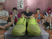 Front view showing lime-green mesh toe areas and lace-up closures