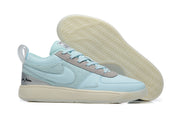 Light blue low-top Nike Book 1 shoe with gray trim and cream sole