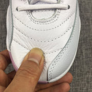 Close-up of the stitched white toe and lace area.