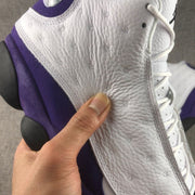 Close-up of the textured white side panel and purple trim