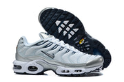 Nike Air Max Plus sneakers shown with the dark outsole and visible cushioning details.