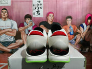 Rear view showing the white heel sections, red collar accents, black heel panels, and fluorescent green outsole details.