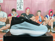 Side profile of a blue-grey and black Jordan Luka 1 basketball shoe