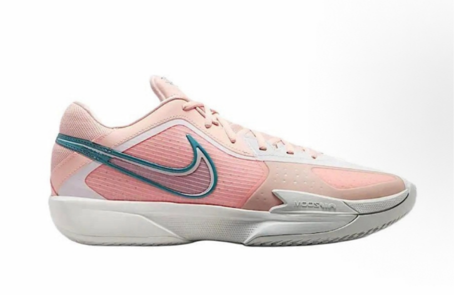 Side view of pink, white, and teal Nike low-top basketball sneakers with a contrasting Swoosh and sculpted outsole.
