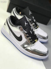 Angled view of a silver and white low-top sneaker showing the black side panel, padded tongue and perforated toe box.
