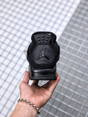 Rear view of the black sneaker showing the Jordan heel logo and padded collar.