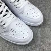Close-up of the perforated white toe boxes and white flat laces.