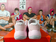 Rear view of pink Nike sneakers showing mesh-look heel panels